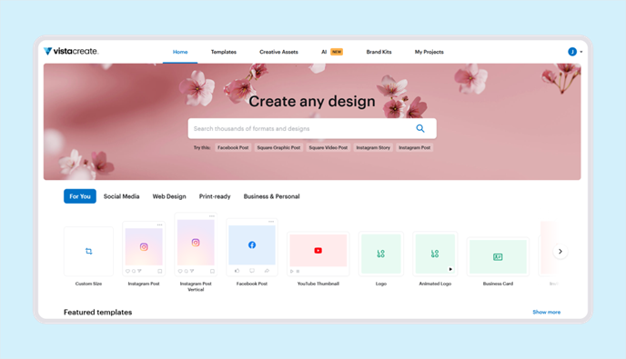 VistaCreate dashboard home screen showing a design search bar, format categories, and featured templates with a floral banner