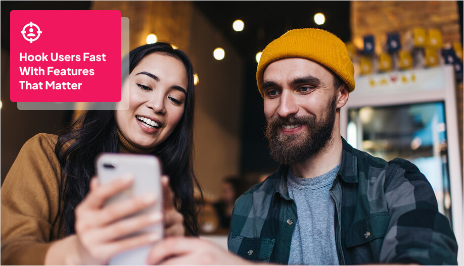 two people looking at a mobile phone