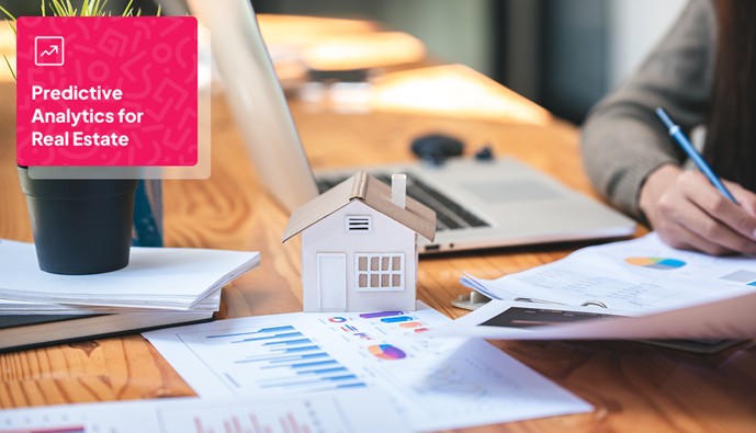 a handmade paper doll house placed on a table with papers showing statistics